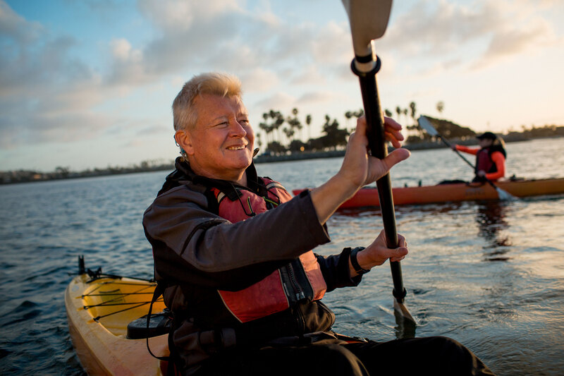 A man wears his Nucleus water-safe accessory over his Cochlear implant as he kayaks