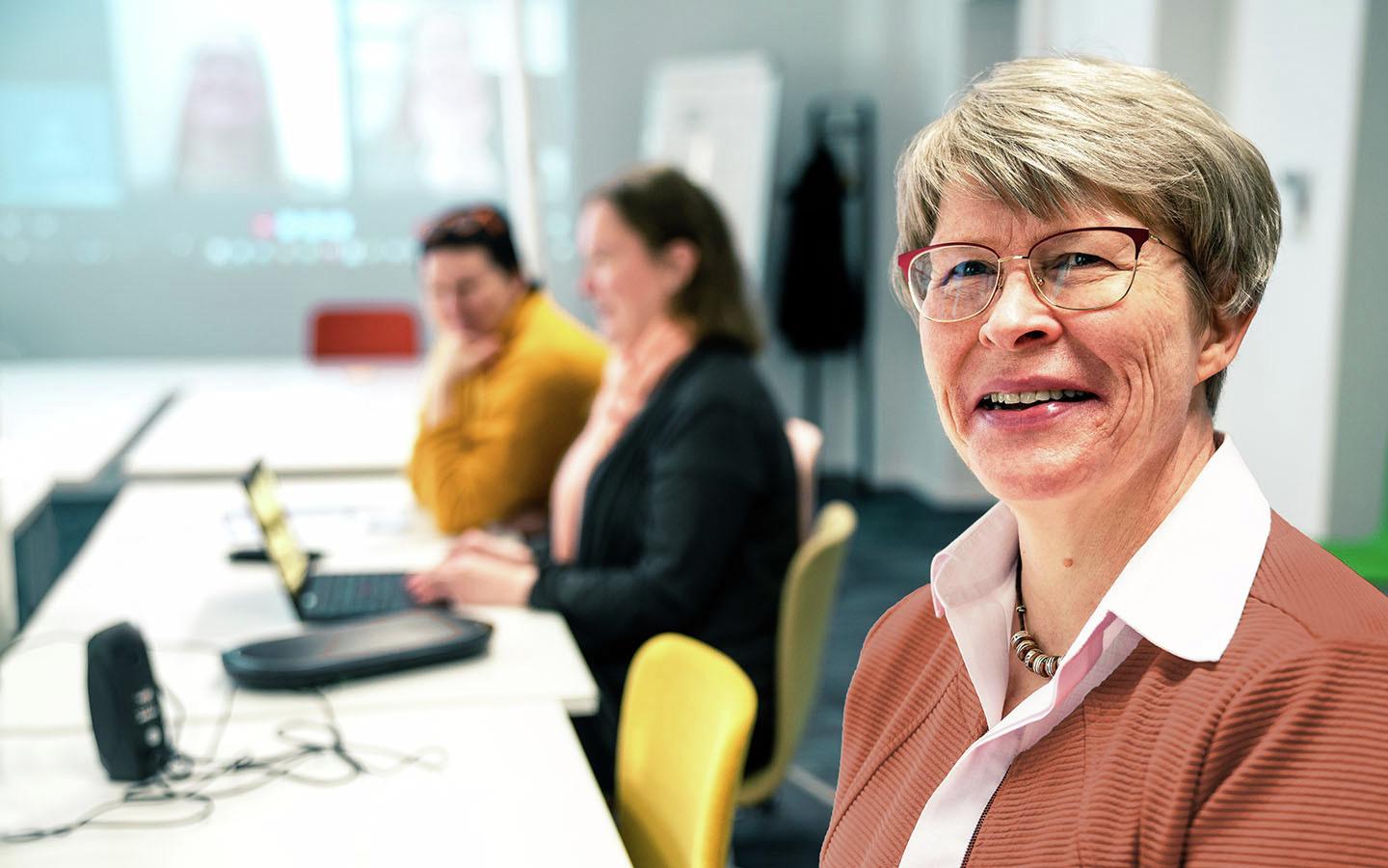 Helinä in an office setting