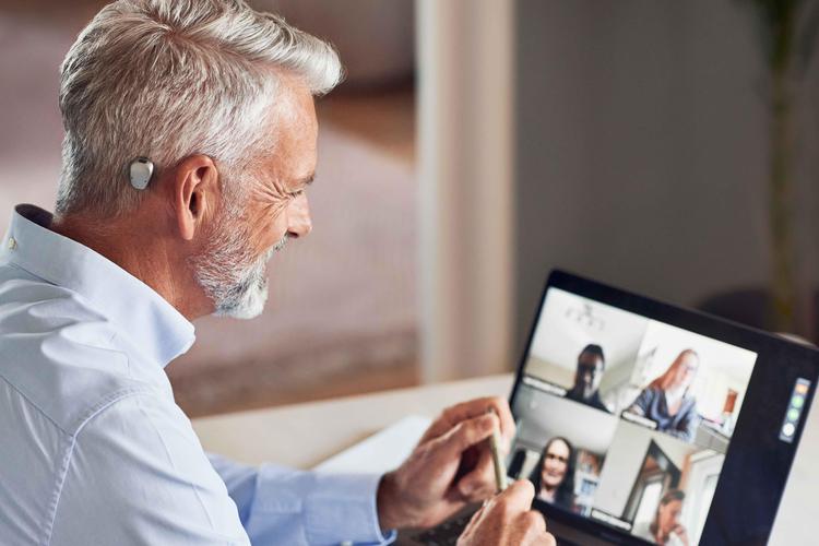 Man with Baha 6 at a video call