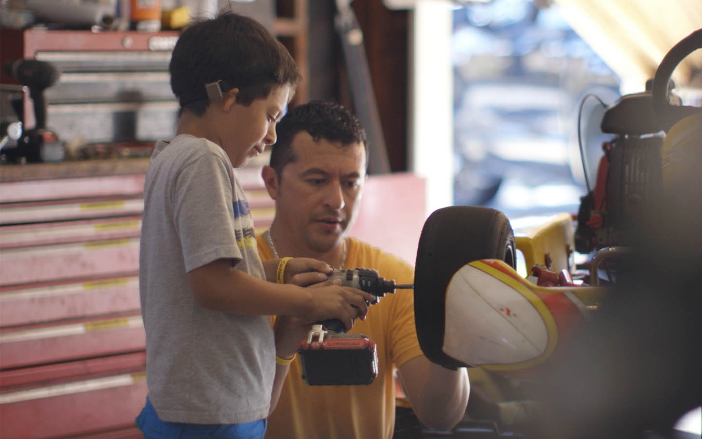 Baha recipient playing with dad