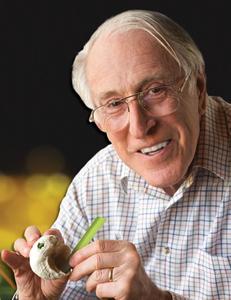 Graeme Clark with shell and blade of grass.jpeg