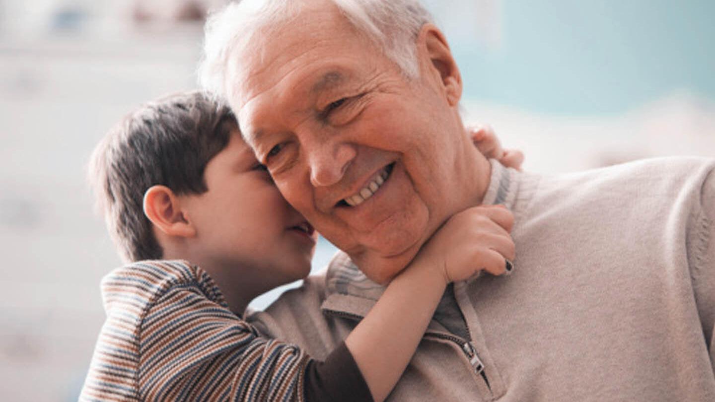 Grandson whispers to grandpa