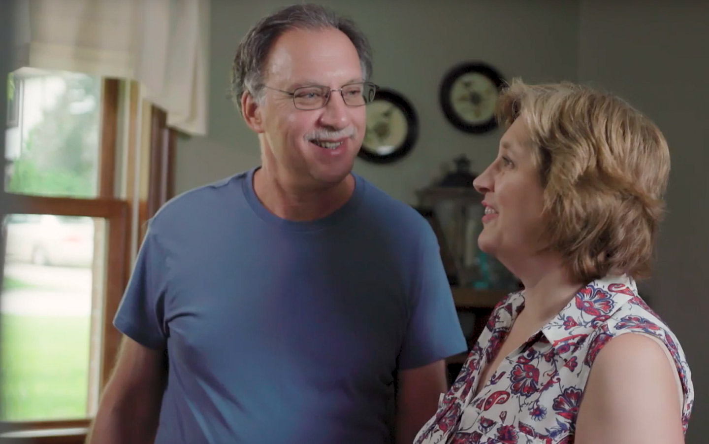 Baha recipient David talking to his wife at home