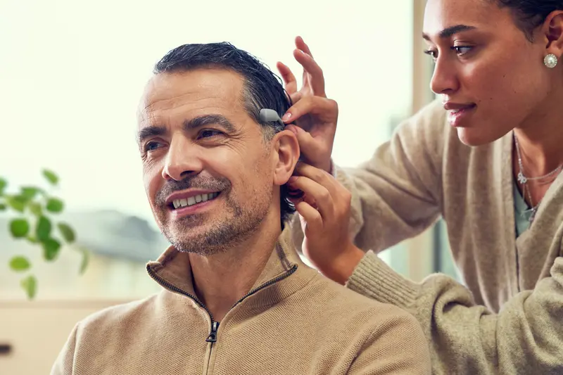 An audiologist with a Cochlear Baha implant recipient.