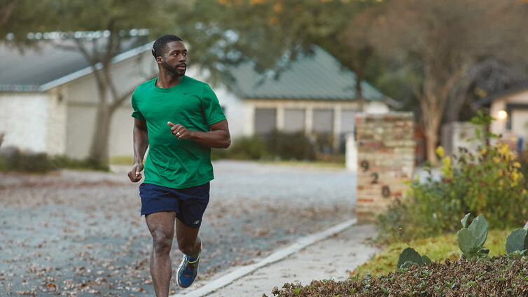 Kanso 2 Recipient jogging on a neighborhood sidewalk