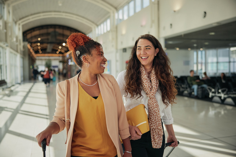 Women at airport with Cochlear Nucleus sound processor.jpg