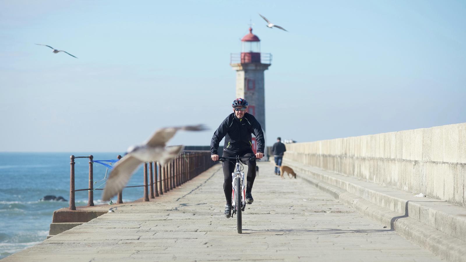 Middle ear implant recipient Alexandre riding a bicycle