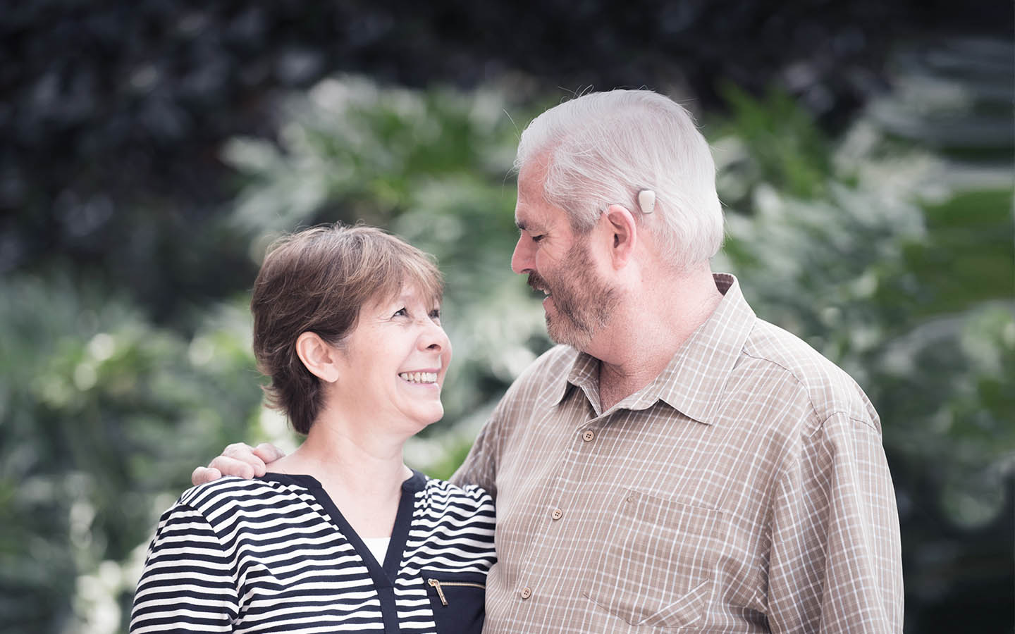 A Baha recipient smiles at his wife