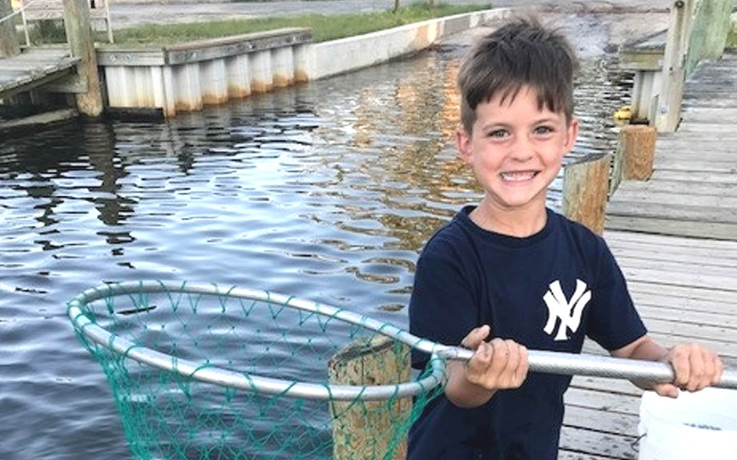 Nucleus recipient Sean poses for a photo with a fishing net