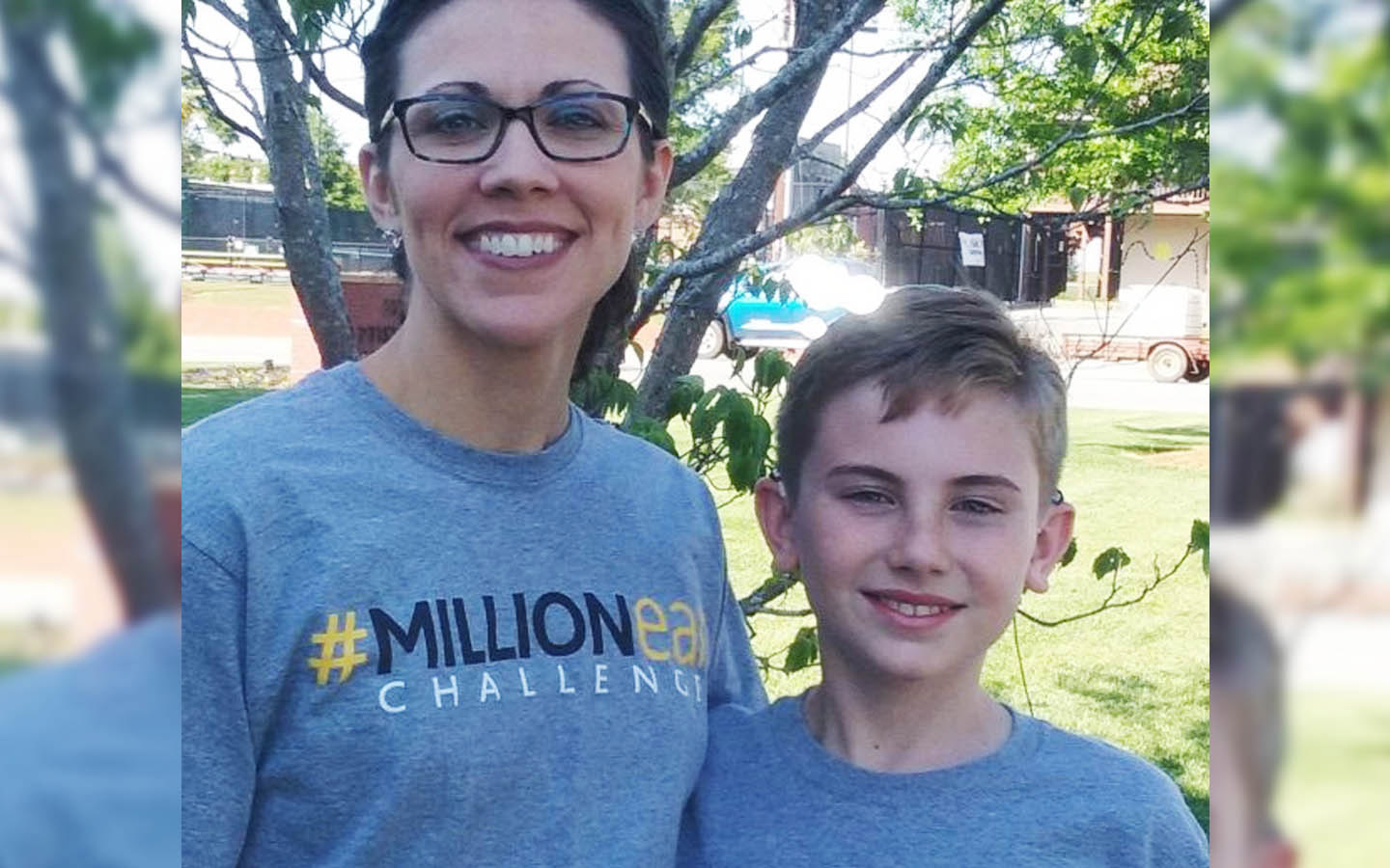 Cochlear recipient Neil and his mother pose for a photo