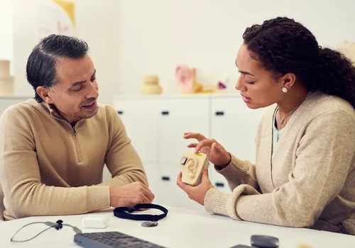 An audiologist explaining how bone conduction hearing works